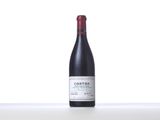 a bottle of wine that is sitting on a table