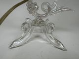 a glass table with a flower on top of it