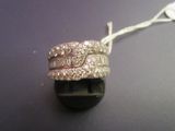 a picture of a diamond ring on a black surface