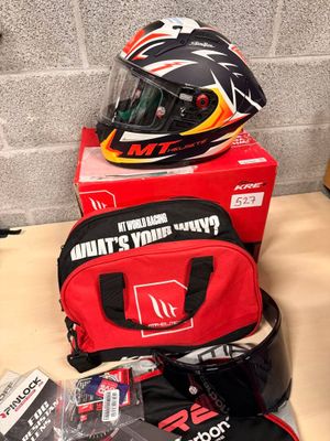 a helmet, gloves, and other items on a table