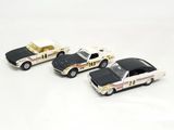 three toy cars that are sitting next to each other