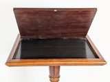 a wooden table with a black top and a wooden base