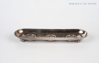 a close up of a metal object on a white surface