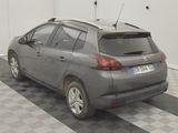 a car that is parked in a garage with a checkered floor