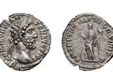 a silver coin with an image of a woman and a man on it