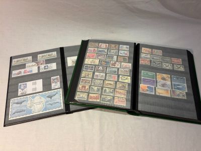 several different types of stamps in a folder on a white surface