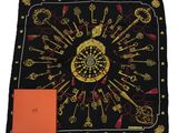 a black scarf with gold keys and keys on it