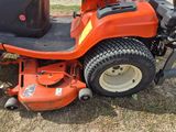 a lawn mower that is sitting in the grass