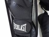 a pair of boxing gloves and a bag on a table