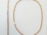 gold and white beaded necklace and bracelet set