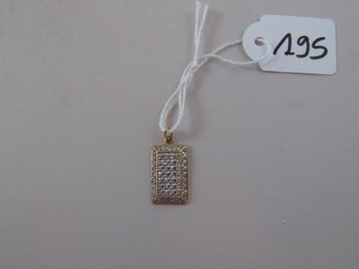 a tag with a small diamond on it on a string