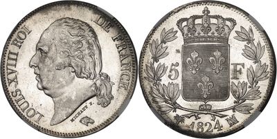 a silver coin with a crown on top of it