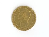 a gold coin with a picture of a man on it