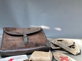 a brown leather case sitting on a table next to a pair of gloves