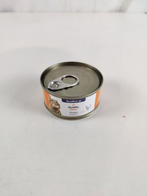 une boîte de nourriture pour chat posée sur une surface blanche