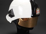 the helmet is white and black with a gold helmet on it