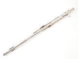 an antique silver plated hair clip with a long metal handle