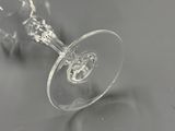 a close up of a wine glass on a table