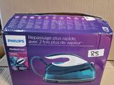 the box is open and ready to be packed with the electric iron