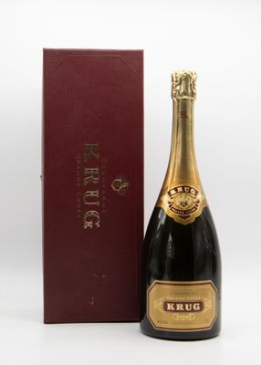 a close up of a bottle of champagne next to a box