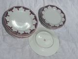 three plates and a bowl sitting on a table
