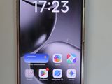 a close up of a cell phone sitting on top of a table