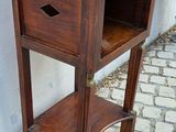 a small wooden table with a drawer on top of it