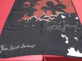 a table with a red table cloth with a picture on it