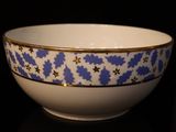 a close up of a bowl on a black surface