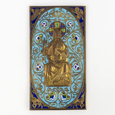 a close up of a gold statue on a blue background