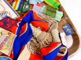 a wooden tray filled with assorted items on top of a table