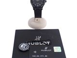 a watch and a credit card sitting on a table