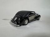 a toy car that is sitting on a white surface