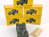 three boxed boxed toys of military vehicles on a white surface