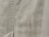 a close up of a person ' s pants on a hanger