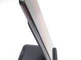 a close up of a cell phone on a stand