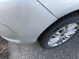 a close up of a car ' s tire on the street
