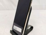 a cell phone that is sitting on a cell phone stand