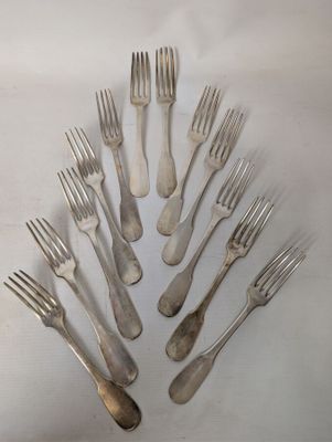 a lot of forks arranged in the shape of a tree