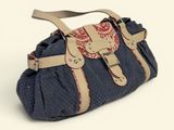 denim and leather handbag with a red and white design