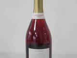 a bottle of wine that is sitting on a table