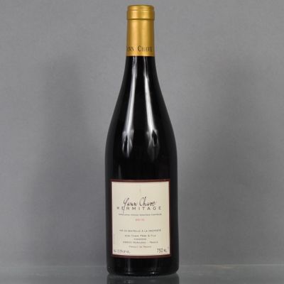 a bottle of wine that is sitting on a table