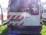 a white van that is parked in the grass