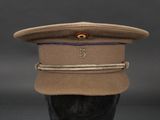 the hat is tan and has a blue band around the brim