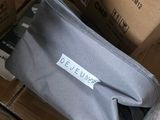 a bag that is sitting on the floor next to some boxes