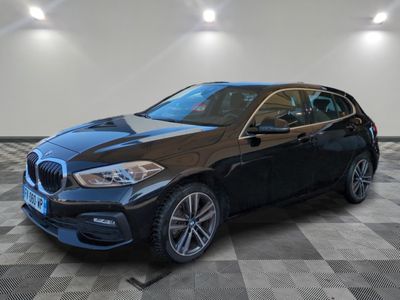 a black bmw x2 parked in a garage