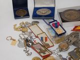 a lot of medals and other items on the table