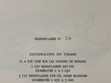 a close up of a page of a book with a picture of a plane