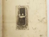 an old book with a picture of a woman in a window