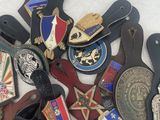 many different types of badges on a white surface